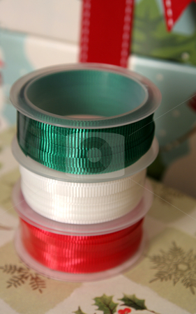 To use this stock image in your creative project, please select the size you need over to the right and click the "Add to Cart" button.
Your downloaded image will come with the Cutcaster watermark removed so don’t worry about the watermark you see on this page. Christmas Ribbon Spools stock photo, Three spools of Christmas gift wrapping ribbon sitting on already wrapped gifts.
by Chris Hill