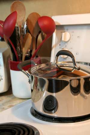 To use this stock image in your creative project, please select the size you need over to the right and click the "Add to Cart" button.
Your downloaded image will come with the Cutcaster watermark removed so don’t worry about the watermark you see on this page. Stovetop Cooking stock photo, Cooking equipment sitting on the stove and on the counter.
by Chris Hill