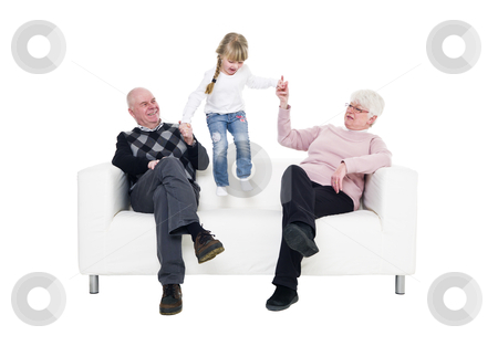 To use this stock image in your creative project, please select the size you need over to the right and click the "Add to Cart" button.
Your downloaded image will come with the Cutcaster watermark removed so don’t worry about the watermark you see on this page. Little Girl with her grandparents stock photo, Little Girl with her grandparents in a sofa isolated on white background by Anne-Louise Quarfoth
