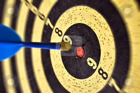To use this stock image in your creative project, please select the size you need over to the right and click the "Add to Cart" button.
Your downloaded image will come with the Cutcaster watermark removed so don’t worry about the watermark you see on this page. Arrow and target stock photo, Dartboard target and dart arrow. Selective focus. by sirylok