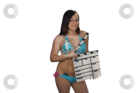 To use this stock image in your creative project, please select the size you need over to the right and click the "Add to Cart" button.
Your downloaded image will come with the Cutcaster watermark removed so don’t worry about the watermark you see on this page. Bikini-clad Brunette with Movie Slate (2) stock photo, A lovely young brunette wearing a bikini with a nautical theme, holds a movie slate against a plain, white background. by Carl Stewart