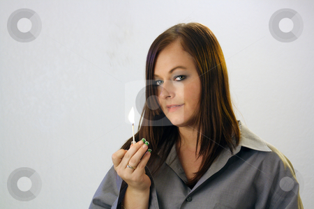 To use this stock image in your creative project, please select the size you need over to the right and click the "Add to Cart" button.
Your downloaded image will come with the Cutcaster watermark removed so don’t worry about the watermark you see on this page. Beautiful Brunette Holds a Burning Match stock photo, A lovely young brunette holds a burning kitchen match. by Carl Stewart