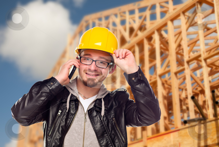 To use this stock image in your creative project, please select the size you need over to the right and click the "Add to Cart" button.
Your downloaded image will come with the Cutcaster watermark removed so don’t worry about the watermark you see on this page. Young Cunstruction Worker on Cell Phone In Front of House stock photo, Young Contractor Wearing Hard Hat on Cell Phone In Front of Construction Site. by Andy Dean