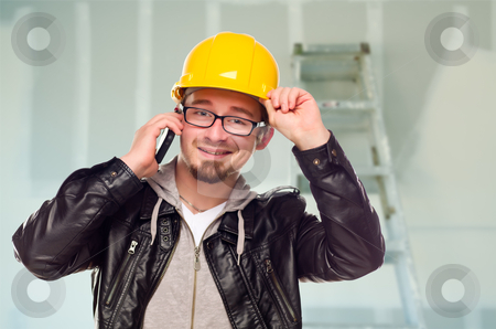 To use this stock image in your creative project, please select the size you need over to the right and click the "Add to Cart" button.
Your downloaded image will come with the Cutcaster watermark removed so don’t worry about the watermark you see on this page. Contractor in Hard Hat on Cell Phone In Unfinished House stock photo, Young Contractor Wearing Hard Hat on Cell Phone In Unfinished House with Drywall and Ladder in the Background. by Andy Dean