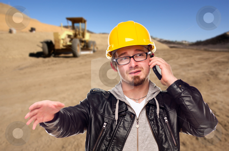 To use this stock image in your creative project, please select the size you need over to the right and click the "Add to Cart" button.
Your downloaded image will come with the Cutcaster watermark removed so don’t worry about the watermark you see on this page. Young Cunstruction Worker on Cell Phone in Dirt Field with Tract stock photo, Young Cunstruction Worker on Cell Phone in Dirt Field with Tractor in the Background. by Andy Dean