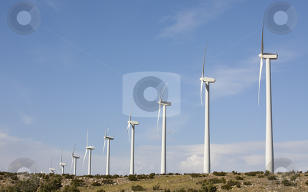 To use this stock image in your creative project, please select the size you need over to the right and click the "Add to Cart" button.
Your downloaded image will come with the Cutcaster watermark removed so don’t worry about the watermark you see on this page. Dramatic Wind Turbine Farm stock photo, Dramatic Wind Turbine Farm in the Desert of California. by Andy Dean