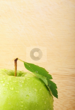 To use this stock image in your creative project, please select the size you need over to the right and click the "Add to Cart" button.
Your downloaded image will come with the Cutcaster watermark removed so don’t worry about the watermark you see on this page. Apple and copyspace stock photo, green fresh apple with water drops and copyspace by Gunnar Pippel