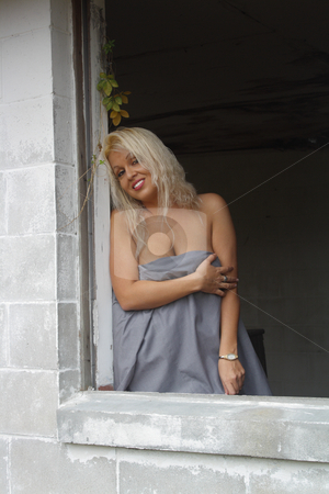 To use this stock image in your creative project, please select the size you need over to the right and click the "Add to Cart" button.
Your downloaded image will come with the Cutcaster watermark removed so don’t worry about the watermark you see on this page. Beautiful Blonde in a Dilapidated House (4) stock photo, A lovely platinum-blonde stands in the window of an abandoned, dilapidated house. by Carl Stewart