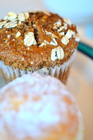 To use this stock image in your creative project, please select the size you need over to the right and click the "Add to Cart" button.
Your downloaded image will come with the Cutcaster watermark removed so don’t worry about the watermark you see on this page. Brown cupcake with oat toppings stock photo, Brown cupcake with oat toppings for a nutritious snack. by Wai Chung Tang