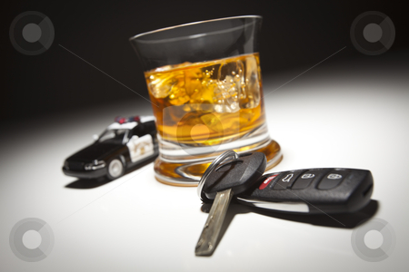 To use this stock image in your creative project, please select the size you need over to the right and click the "Add to Cart" button.
Your downloaded image will come with the Cutcaster watermark removed so don’t worry about the watermark you see on this page. Highway Patrol Police Car Next to Alcoholic Drink and Keys stock photo, Highway Patrol Police Car Next to Alcoholic Drink and Keys Under Spot Light. by Andy Dean