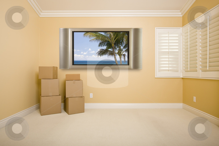 To use this stock image in your creative project, please select the size you need over to the right and click the "Add to Cart" button.
Your downloaded image will come with the Cutcaster watermark removed so don’t worry about the watermark you see on this page. Flat Panel Television on Wall in Empty Room with Boxes stock photo, Flat Panel Television on Wall with Tropical Scene in Empty Room with Boxes. by Andy Dean