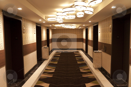 To use this stock image in your creative project, please select the size you need over to the right and click the "Add to Cart" button.
Your downloaded image will come with the Cutcaster watermark removed so don’t worry about the watermark you see on this page. Elevator Lobby stock photo, A hotel elevator lobby that leads to the hotel rooms by Kevin Tietz