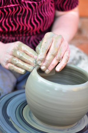 To use this stock image in your creative project, please select the size you need over to the right and click the "Add to Cart" button.
Your downloaded image will come with the Cutcaster watermark removed so don’t worry about the watermark you see on this page. Hands of a potter stock photo, The hands of a potter creating an earthen jar by Tudor Antonel adrian