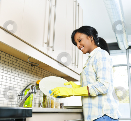 To use this stock image in your creative project, please select the size you need over to the right and click the "Add to Cart" button.
Your downloaded image will come with the Cutcaster watermark removed so don’t worry about the watermark you see on this page. Young woman washing dishes stock photo, Smiling young black woman washing dishes in kitchen by Elena Elisseeva