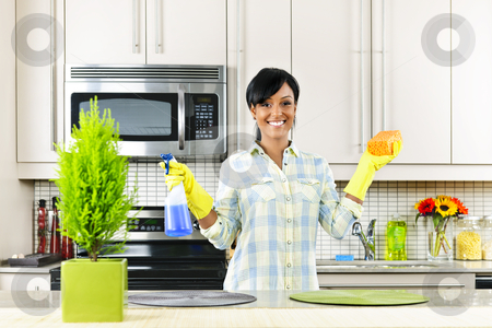 To use this stock image in your creative project, please select the size you need over to the right and click the "Add to Cart" button.
Your downloaded image will come with the Cutcaster watermark removed so don’t worry about the watermark you see on this page. Young woman cleaning kitchen stock photo, Smiling young black woman with sponge and rubber gloves cleaning kitchen by Elena Elisseeva