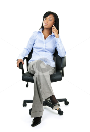 To use this stock image in your creative project, please select the size you need over to the right and click the "Add to Cart" button.
Your downloaded image will come with the Cutcaster watermark removed so don’t worry about the watermark you see on this page. Businesswoman on phone sitting in office chair stock photo, Young confident black businesswoman on phone sitting in leather office chair by Elena Elisseeva