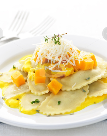To use this stock image in your creative project, please select the size you need over to the right and click the "Add to Cart" button.
Your downloaded image will come with the Cutcaster watermark removed so don’t worry about the watermark you see on this page. Ravioli dinner stock photo, Gourmet squash ravioli dinner served with cheese on plate by Elena Elisseeva