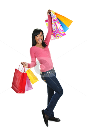 To use this stock image in your creative project, please select the size you need over to the right and click the "Add to Cart" button.
Your downloaded image will come with the Cutcaster watermark removed so don’t worry about the watermark you see on this page. Excited young black woman with shopping bags stock photo, Young excited smiling black woman holding shopping bags by Elena Elisseeva