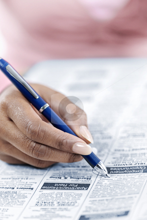 To use this stock image in your creative project, please select the size you need over to the right and click the "Add to Cart" button.
Your downloaded image will come with the Cutcaster watermark removed so don’t worry about the watermark you see on this page. Hand circling ad in newspaper stock photo, Black female hand circling ad in newspaper classified section looking for job by Elena Elisseeva