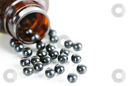 To use this stock image in your creative project, please select the size you need over to the right and click the "Add to Cart" button.
Your downloaded image will come with the Cutcaster watermark removed so don’t worry about the watermark you see on this page. Chinese herbal patent medicine pills stock photo, Traditional chinese herbal medicine pills spilling from bottle on white background by Elena Elisseeva