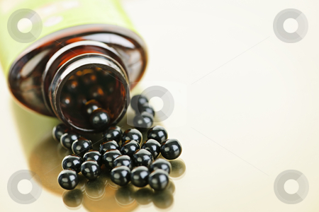 To use this stock image in your creative project, please select the size you need over to the right and click the "Add to Cart" button.
Your downloaded image will come with the Cutcaster watermark removed so don’t worry about the watermark you see on this page. Chinese herbal patent medicine pills stock photo, Traditional chinese herbal medicine pills spilling from bottle by Elena Elisseeva