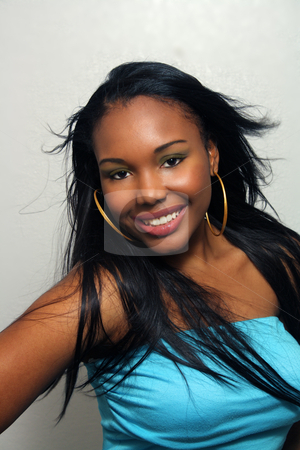 To use this stock image in your creative project, please select the size you need over to the right and click the "Add to Cart" button.
Your downloaded image will come with the Cutcaster watermark removed so don’t worry about the watermark you see on this page. Beautiful Haitian Girl, Headshot (6) stock photo, A close-up of a lovely young Haitian girl with a captivating smile. by Carl Stewart