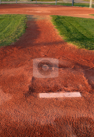 To use this stock image in your creative project, please select the size you need over to the right and click the "Add to Cart" button.
Your downloaded image will come with the Cutcaster watermark removed so don’t worry about the watermark you see on this page. Behind the Mound stock photo, A view from directly behind a pitchers mound.
by Chris Hill