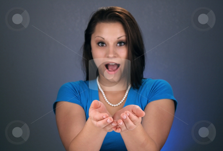 To use this stock image in your creative project, please select the size you need over to the right and click the "Add to Cart" button.
Your downloaded image will come with the Cutcaster watermark removed so don’t worry about the watermark you see on this page. Beautiful Brunette with Hands Cupped (3) stock photo, A lovely young brunette has her hands cupped in front of her, looking at the camera with a bright, warm smile, obviously very excited about whatever you choose to have her holding. Selective focus on the palms of her hands leaves her face slightly defocused to emphasize the product, graphic, or whatever else you put in her hands. by Carl Stewart