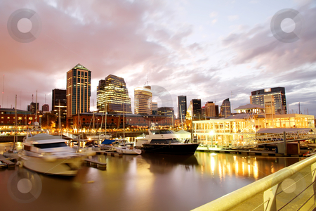 To use this stock image in your creative project, please select the size you need over to the right and click the "Add to Cart" button.
Your downloaded image will come with the Cutcaster watermark removed so don’t worry about the watermark you see on this page. Puerto Madero, Buenos Aires stock photo, Nightly panorama of the Puerto Madero in Buenos Aires, Argentina. by Michael Osterrieder