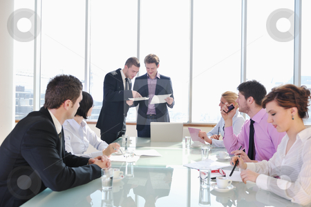To use this stock image in your creative project, please select the size you need over to the right and click the "Add to Cart" button.
Your downloaded image will come with the Cutcaster watermark removed so don’t worry about the watermark you see on this page. Group of business people at meeting stock photo, young business people group have meeting at conference room and have discusion about new ideas plans and problems by Benis Arapovic