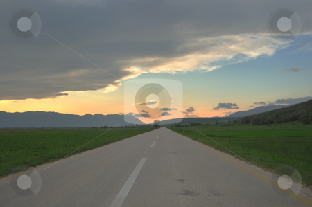 To use this stock image in your creative project, please select the size you need over to the right and click the "Add to Cart" button.
Your downloaded image will come with the Cutcaster watermark removed so don’t worry about the watermark you see on this page. Countryroad adventure with beautiful sunset stock photo, landscape in nature and countryroad adventure with beautiful sunset and dramatic clouds and sky by Benis Arapovic