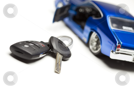 To use this stock image in your creative project, please select the size you need over to the right and click the "Add to Cart" button.
Your downloaded image will come with the Cutcaster watermark removed so don’t worry about the watermark you see on this page. Car Key and Sports Car stock photo, Car Key and Sports Car Under Spot Light. by Andy Dean