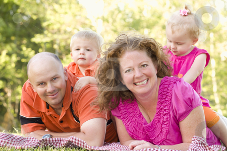 To use this stock image in your creative project, please select the size you need over to the right and click the "Add to Cart" button.
Your downloaded image will come with the Cutcaster watermark removed so don’t worry about the watermark you see on this page. Happy Young Family with Twins Portrait in Park stock photo, Happy Young Adorable Family with Twins Portrait in the Park. by Andy Dean