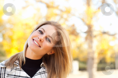 To use this stock image in your creative project, please select the size you need over to the right and click the "Add to Cart" button.
Your downloaded image will come with the Cutcaster watermark removed so don’t worry about the watermark you see on this page. Pretty Young Woman Smiling in the Park stock photo, Pretty Young Woman Smiling in the Park on a Fall Day. by Andy Dean