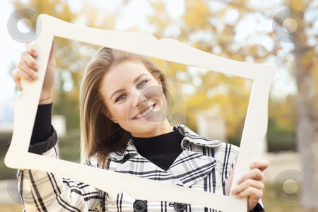 To use this stock image in your creative project, please select the size you need over to the right and click the "Add to Cart" button.
Your downloaded image will come with the Cutcaster watermark removed so don’t worry about the watermark you see on this page. Pretty Young Woman Smiling in the Park with Picture Frame stock photo, Pretty Young Woman Smiling in the Park on a Fall Day with Picture Frame. by Andy Dean