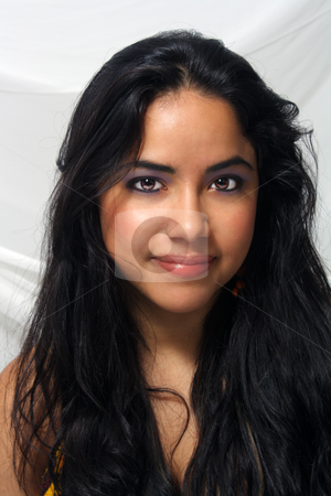 To use this stock image in your creative project, please select the size you need over to the right and click the "Add to Cart" button.
Your downloaded image will come with the Cutcaster watermark removed so don’t worry about the watermark you see on this page. Beautiful Latina Headshot (2) stock photo, Close-up of a lovely teenage Latina with long, luscious black hair. by Carl Stewart