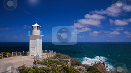 To use this stock image in your creative project, please select the size you need over to the right and click the "Add to Cart" button.
Your downloaded image will come with the Cutcaster watermark removed so don’t worry about the watermark you see on this page. Lighthouse stock photo, Lighthouse over looking the sea view, warning to ships carring cargo by Vividrange