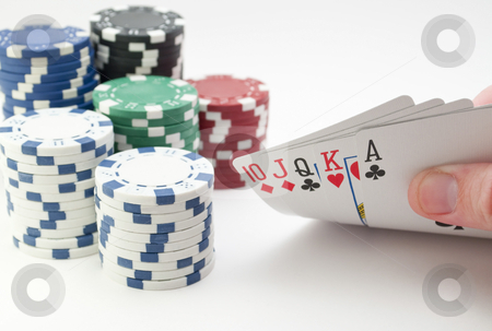 To use this stock image in your creative project, please select the size you need over to the right and click the "Add to Cart" button.
Your downloaded image will come with the Cutcaster watermark removed so don’t worry about the watermark you see on this page. Poker Straight stock photo, Low angle shot of hand lifting up a straight with chips in the background, isolated on white. by Michael T
