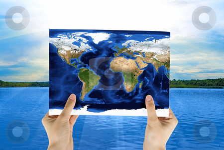 To use this stock image in your creative project, please select the size you need over to the right and click the "Add to Cart" button.
Your downloaded image will come with the Cutcaster watermark removed so don’t worry about the watermark you see on this page. Map stock photo, Hand holding map at beauty sunset on river background by olinchuk