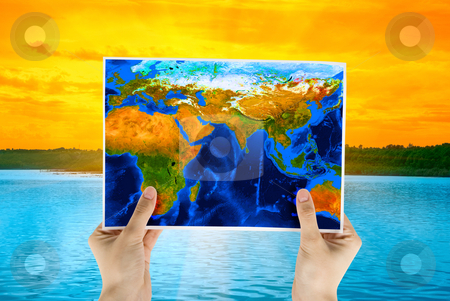 To use this stock image in your creative project, please select the size you need over to the right and click the "Add to Cart" button.
Your downloaded image will come with the Cutcaster watermark removed so don’t worry about the watermark you see on this page. Map stock photo, Hand holding map at beauty sunset on Lake, and orange sky by olinchuk