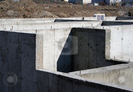 To use this stock image in your creative project, please select the size you need over to the right and click the "Add to Cart" button.
Your downloaded image will come with the Cutcaster watermark removed so don’t worry about the watermark you see on this page. Cement Foundation stock photo, The cement foundation of a new housing development. by Chris Hill