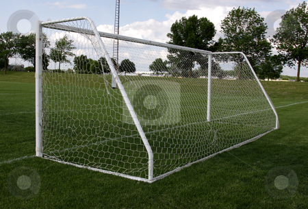 To use this stock image in your creative project, please select the size you need over to the right and click the "Add to Cart" button.
Your downloaded image will come with the Cutcaster watermark removed so don’t worry about the watermark you see on this page. View from Behind the Net stock photo, A view from behind the net on a soccer pitch. by Chris Hill