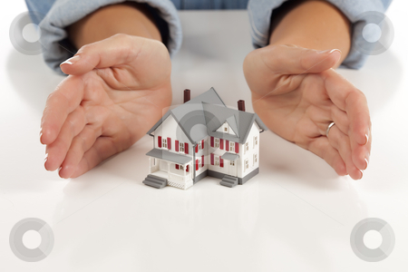 To use this stock image in your creative project, please select the size you need over to the right and click the "Add to Cart" button.
Your downloaded image will come with the Cutcaster watermark removed so don’t worry about the watermark you see on this page. Womans Hands Around Model House stock photo, Womans Hands Around Model House on White Surface. by Andy Dean