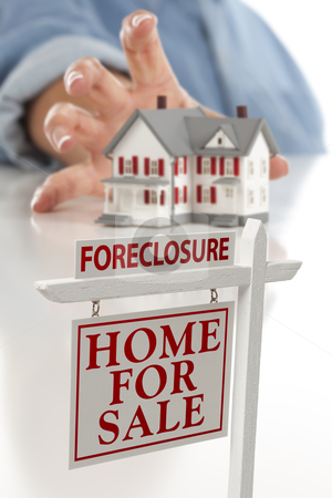 To use this stock image in your creative project, please select the size you need over to the right and click the "Add to Cart" button.
Your downloaded image will come with the Cutcaster watermark removed so don’t worry about the watermark you see on this page. Foreclosure Sign in Front of Woman Reaching for House stock photo, Foreclosure Real Estate Sign in Front of Womans Hand Reaching for Model House on a White Surface. by Andy Dean