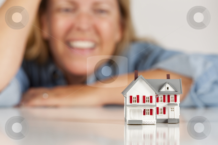 To use this stock image in your creative project, please select the size you need over to the right and click the "Add to Cart" button.
Your downloaded image will come with the Cutcaster watermark removed so don’t worry about the watermark you see on this page. Smiling Woman Behind Model House on a White Surface stock photo, Smiling Woman Leaning on Hands Behind Model House on a White Surface. by Andy Dean