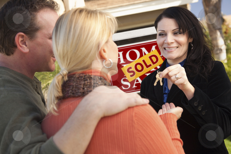 To use this stock image in your creative project, please select the size you need over to the right and click the "Add to Cart" button.
Your downloaded image will come with the Cutcaster watermark removed so don’t worry about the watermark you see on this page. Attractive Hispanic Female Real Estate Agent Handing Over Keys stock photo, Attractive Hispanic Female Real Estate Agent Handing Over New House Keys to Happy Couple. by Andy Dean