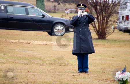 To use this stock image in your creative project, please select the size you need over to the right and click the "Add to Cart" button.
Your downloaded image will come with the Cutcaster watermark removed so don’t worry about the watermark you see on this page. Bugler stock photo, A bugler paying Taps at a military funeral. by Robert Byron