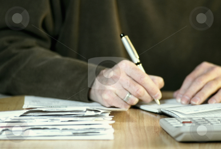 To use this stock image in your creative project, please select the size you need over to the right and click the "Add to Cart" button.
Your downloaded image will come with the Cutcaster watermark removed so don’t worry about the watermark you see on this page. Paying bills stock photo, Man paying bills, concept photography, model released by Bryan Mullennix