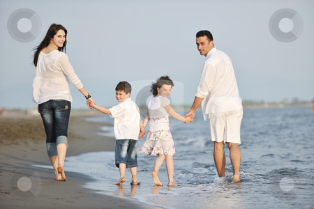 To use this stock image in your creative project, please select the size you need over to the right and click the "Add to Cart" button.
Your downloaded image will come with the Cutcaster watermark removed so don’t worry about the watermark you see on this page. Happy young family have fun on beach at sunset stock photo, happy young family have fun on beach run and jump at sunset by Benis Arapovic