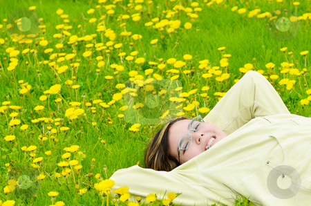 To use this stock image in your creative project, please select the size you need over to the right and click the "Add to Cart" button.
Your downloaded image will come with the Cutcaster watermark removed so don’t worry about the watermark you see on this page. Girl Relaxing In The Sun stock photo, A young preteen girl is lying in the grass, relaxing in the sun. by Richard Nelson